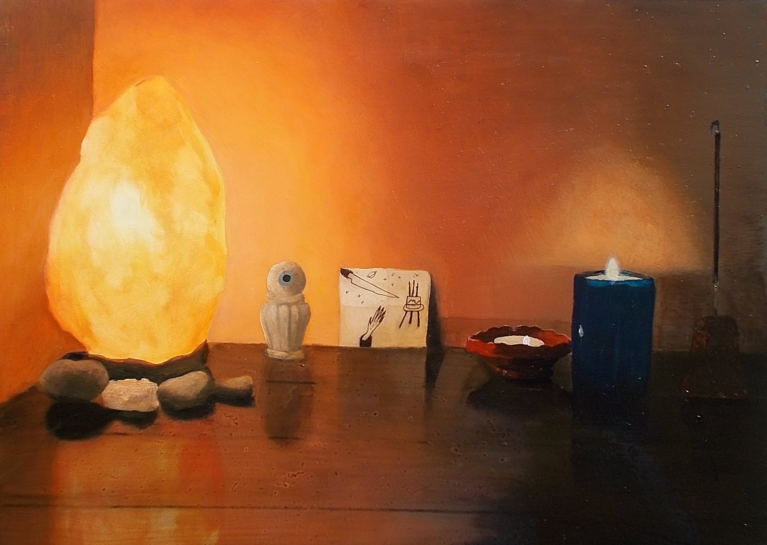 salt lamp and other small objects on a table in a row