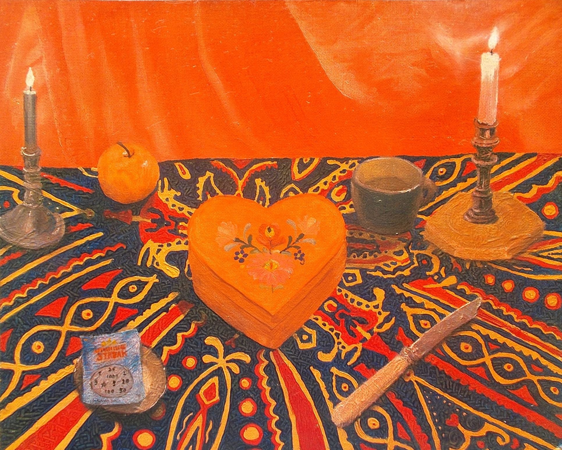 heart shaped box, scratchcard, knife and other ritual objects on patterned cloth